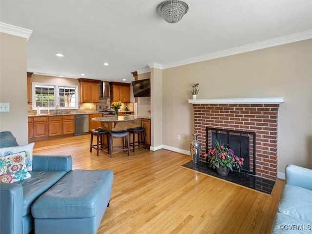 9208 Gayton Rd, Glen Allen, VA 23229 - living room with ornamental molding, light wood-style flooring, a fireplace, and recessed lighting