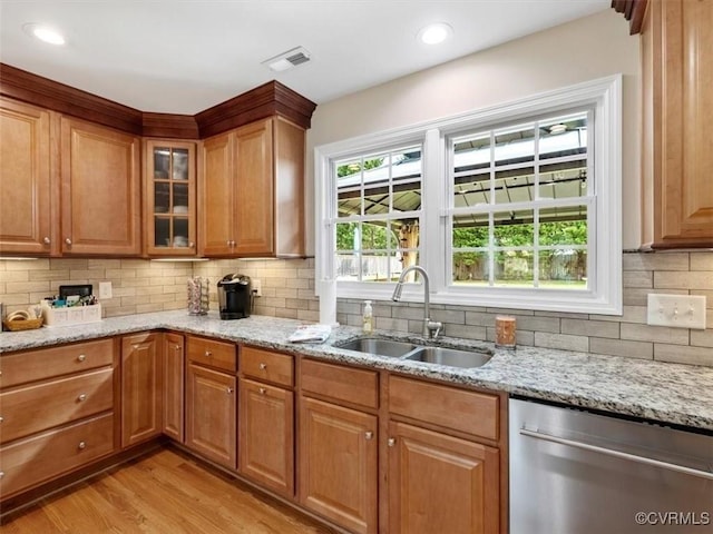 9208 Gayton Rd, Glen Allen, VA 23229 - kitchen featuring stainless steel dishwasher, light wood-type flooring, light stone counters, backsplash, and glass insert cabinets