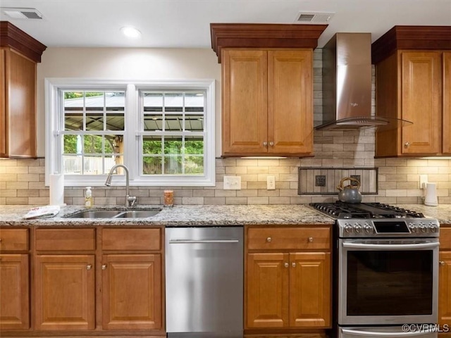 9208 Gayton Rd, Glen Allen, VA 23229 - kitchen featuring wall chimney range hood, stainless steel appliances, light stone countertops, tasteful backsplash, and recessed lighting