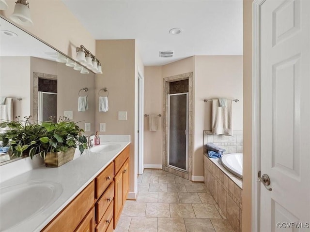 9208 Gayton Rd, Glen Allen, VA 23229 - full bath featuring a shower stall, double vanity, and a garden tub