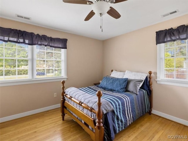 9208 Gayton Rd, Glen Allen, VA 23229 - bedroom featuring multiple windows, light wood finished floors, and ceiling fan