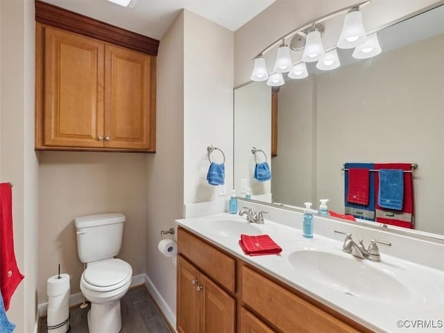 9208 Gayton Rd, Glen Allen, VA 23229 - bathroom featuring double vanity and wood finished floors