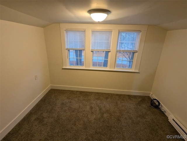 6080 Buckley Hall Rd, Mathews, VA 23035 - empty room with dark carpet, baseboards, and vaulted ceiling