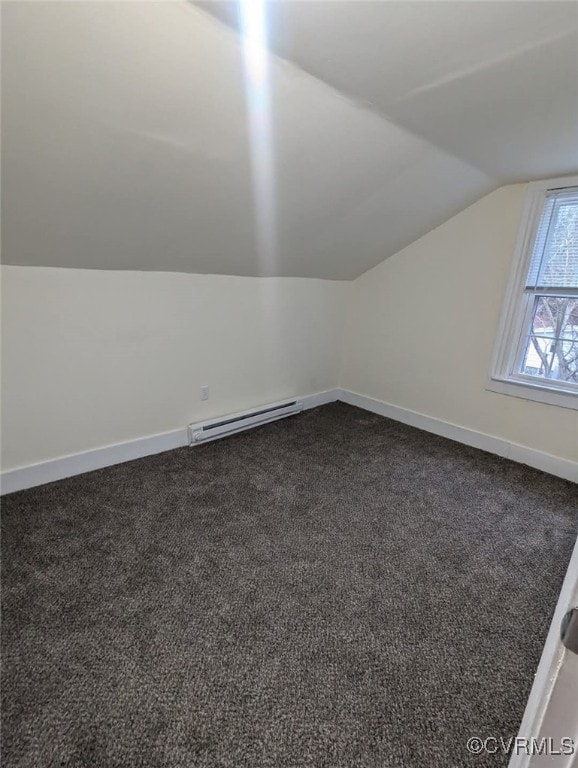 6080 Buckley Hall Rd, Mathews, VA 23035 - bonus room featuring baseboards, dark colored carpet, vaulted ceiling, and baseboard heating