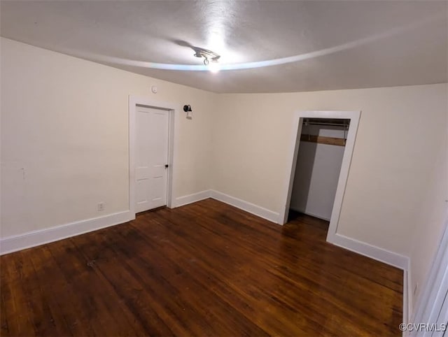 6080 Buckley Hall Rd, Mathews, VA 23035 - unfurnished bedroom featuring a closet, baseboards, and wood finished floors