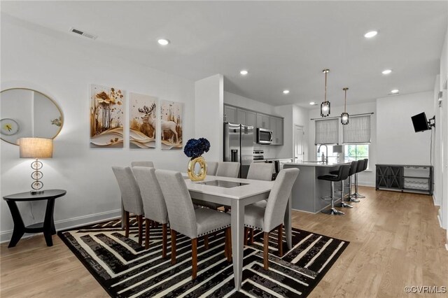 7217 Leire Ln, Chesterfield, VA 23832 - dining room featuring light wood-style floors, recessed lighting, and baseboards