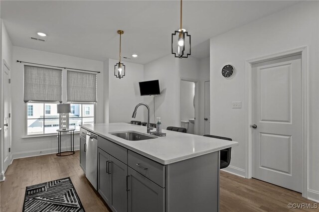 7217 Leire Ln, Chesterfield, VA 23832 - kitchen featuring gray cabinets, a sink, light countertops, dark wood-style flooring, and hanging light fixtures