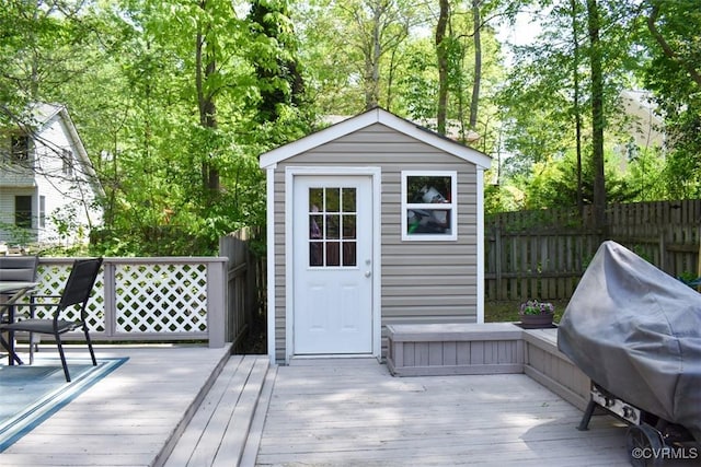 view of shed with fence