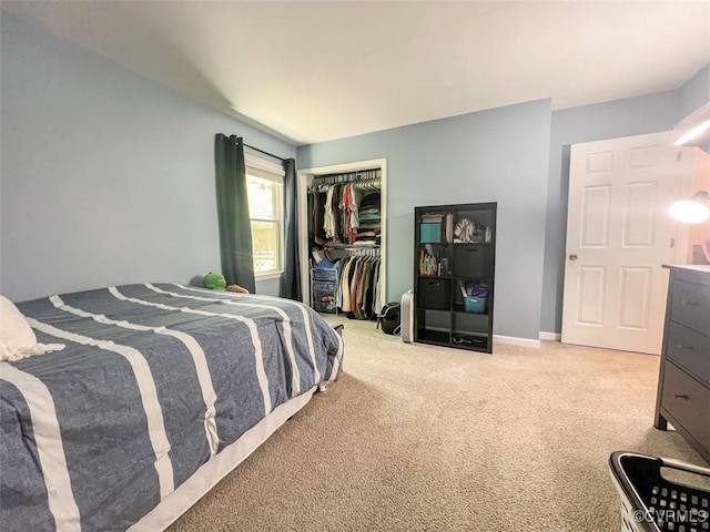 carpeted bedroom with a closet