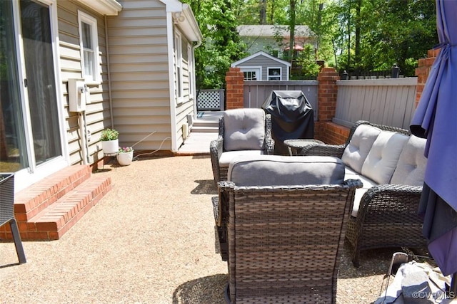 view of patio featuring fence