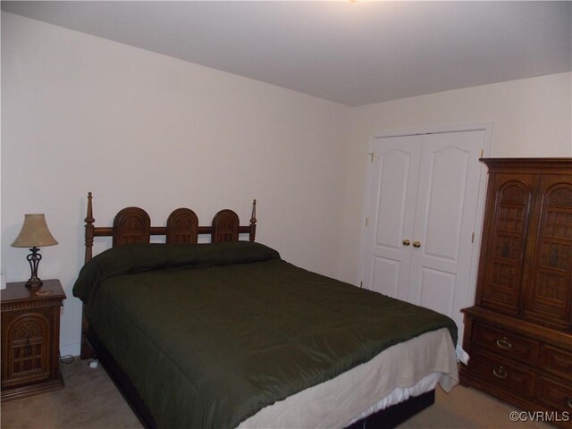 8304 Elizabeth Ann Dr, Hanover, VA 23111 - bedroom featuring light colored carpet and a closet