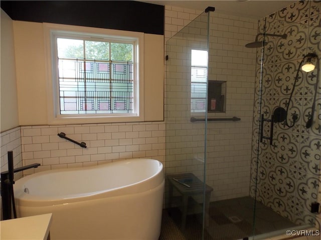 8304 Elizabeth Ann Dr, Hanover, VA 23111 - full bathroom with tile walls, a shower stall, and a freestanding tub
