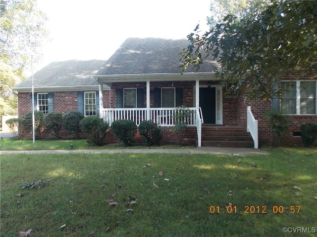 8304 Elizabeth Ann Dr, Hanover, VA 23111 - view of front of house featuring brick siding, a front yard, and a porch