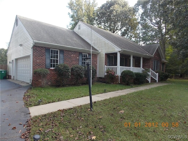 8304 Elizabeth Ann Dr, Hanover, VA 23111 - view of front of property featuring a porch, brick siding, driveway, a front yard, and a garage