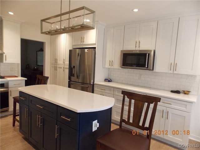 8304 Elizabeth Ann Dr, Hanover, VA 23111 - kitchen featuring stainless steel appliances, white cabinetry, tasteful backsplash, light countertops, and recessed lighting