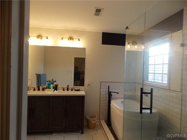 8304 Elizabeth Ann Dr, Hanover, VA 23111 - full bath with a garden tub, double vanity, tile patterned floors, and a shower