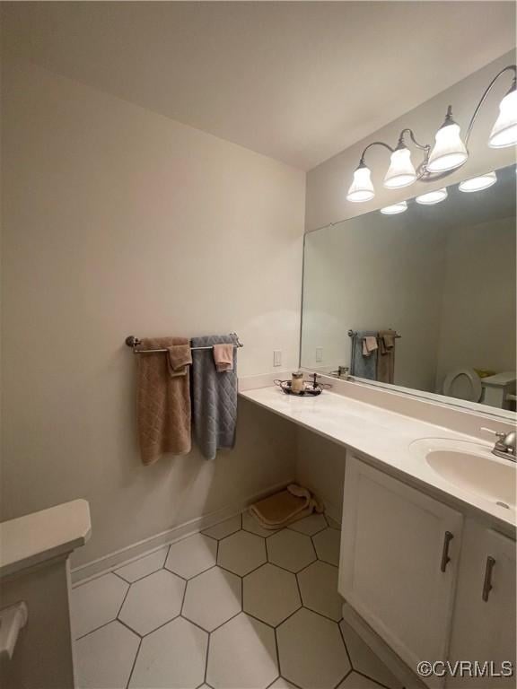 8304 Elizabeth Ann Dr, Hanover, VA 23111 - bathroom with double vanity and baseboards