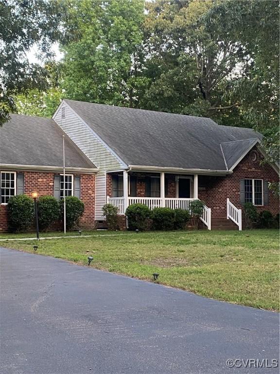 8304 Elizabeth Ann Dr, Hanover, VA 23111 - single story home featuring brick siding, a front yard, and a porch