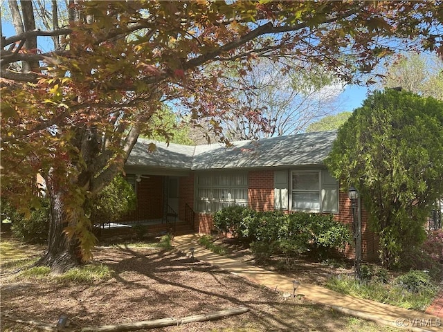 view of front of home with brick siding