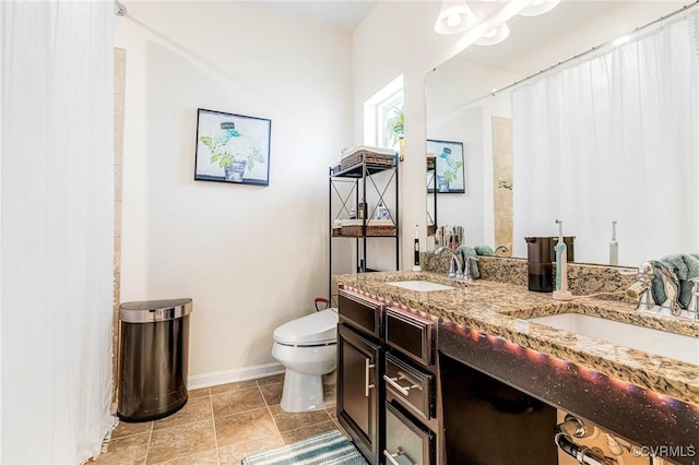 4341 Kenmare Ct, Richmond, VA 23234 - full bathroom with toilet, double vanity, baseboards, a shower with curtain, and tile patterned flooring