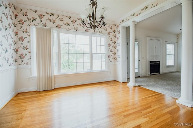 240 Lighthouse Pointe, North Prince George, VA 23860 - unfurnished dining area featuring ornate columns, wallpapered walls, ornamental molding, light wood-type flooring, and a chandelier
