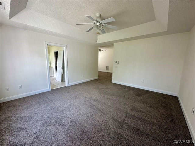 240 Lighthouse Pointe, North Prince George, VA 23860 - carpeted empty room with ceiling fan, a textured ceiling, a tray ceiling, and baseboards