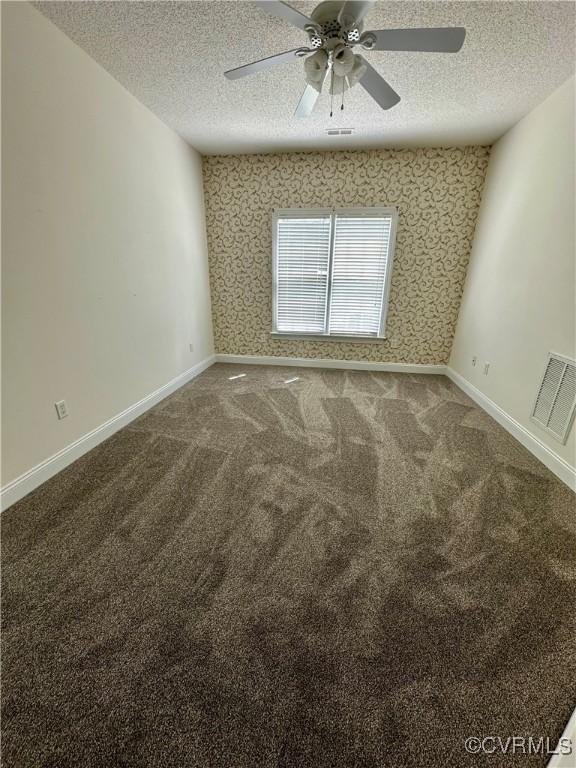 240 Lighthouse Pointe, North Prince George, VA 23860 - empty room with a textured ceiling, carpet flooring, ceiling fan, and baseboards