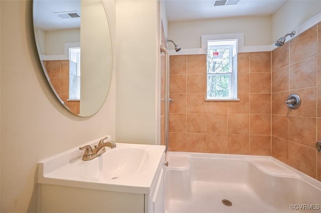 full bathroom featuring vanity and visible vents