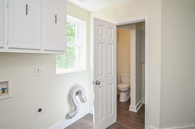 laundry area with cabinet space, baseboards, dark wood-style flooring, and hookup for an electric dryer