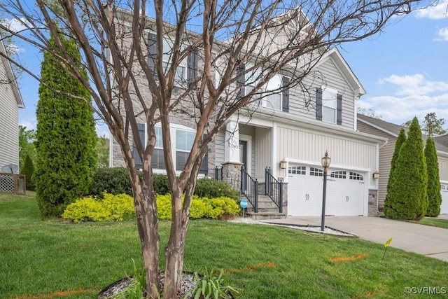 traditional-style house with an attached garage, concrete driveway, and a front yard