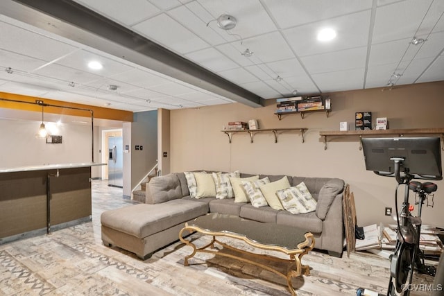 living area featuring recessed lighting and stairs
