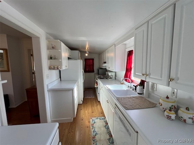 211 Taylor Ave, Urbanna, VA 23175 - kitchen with white appliances, light countertops, white cabinets, light wood-style floors, and a sink