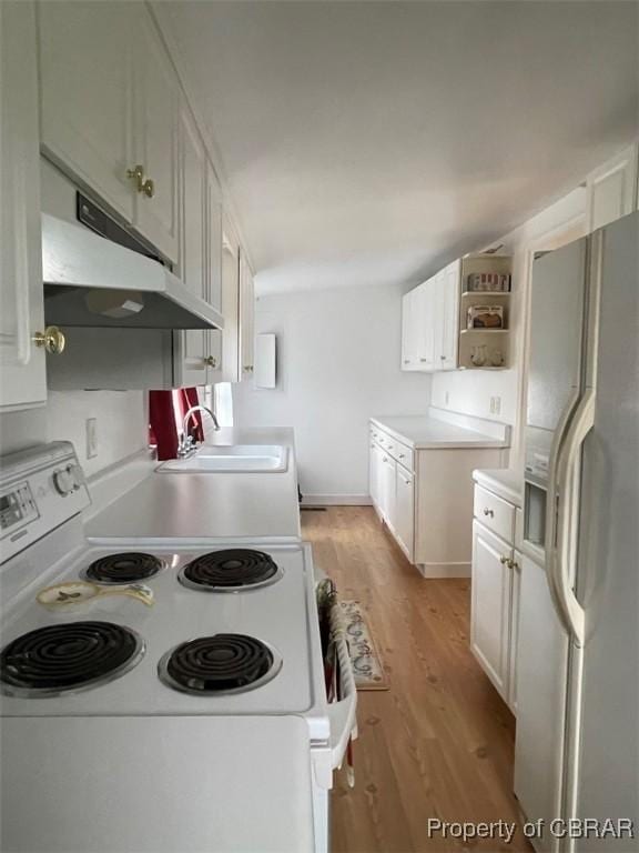 211 Taylor Ave, Urbanna, VA 23175 - kitchen with open shelves, a sink, light wood-type flooring, white appliances, and under cabinet range hood