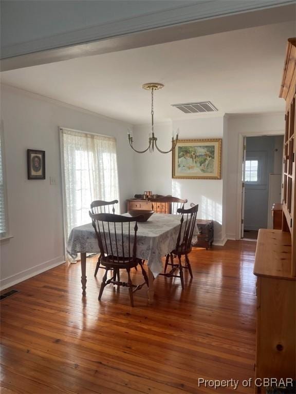 211 Taylor Ave, Urbanna, VA 23175 - dining area with visible vents, baseboards, a notable chandelier, and dark wood finished floors