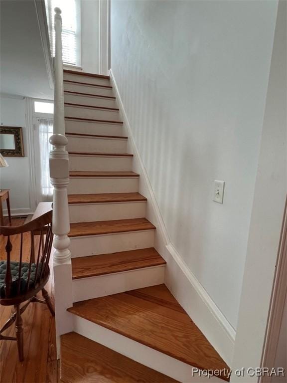211 Taylor Ave, Urbanna, VA 23175 - staircase featuring baseboards and wood finished floors