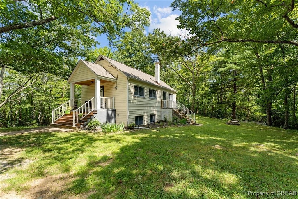 1376 Wyatt Mountain Rd, Dyke, VA 22935 - view of home's exterior with stairway, a lawn, and a chimney