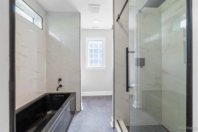 full bath featuring visible vents, baseboards, a marble finish shower, and tile patterned flooring