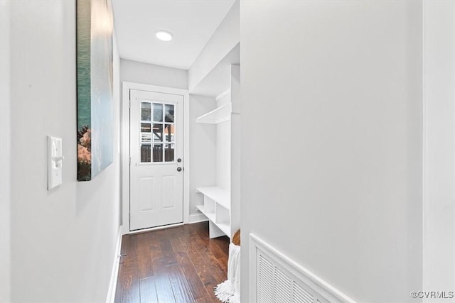mudroom featuring baseboards and dark wood-style flooring