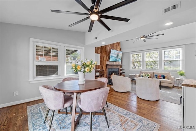 dining area with vaulted ceiling, visible vents, ceiling fan, and a healthy amount of sunlight