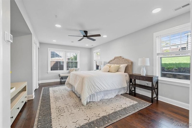 bedroom featuring ceiling fan, baseboards, dark wood-style flooring, visible vents, and recessed lighting