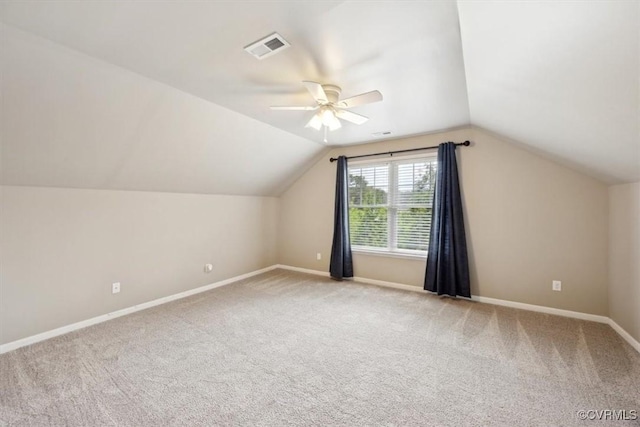 additional living space featuring carpet floors, ceiling fan, visible vents, and baseboards