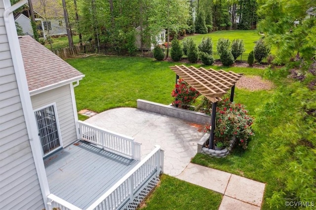 exterior space with fence, a yard, and a patio area