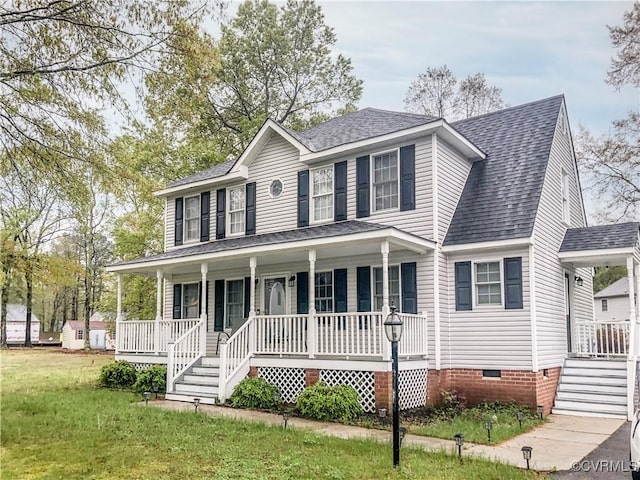colonial inspired home featuring a front lawn, covered porch, crawl space, and roof with shingles
