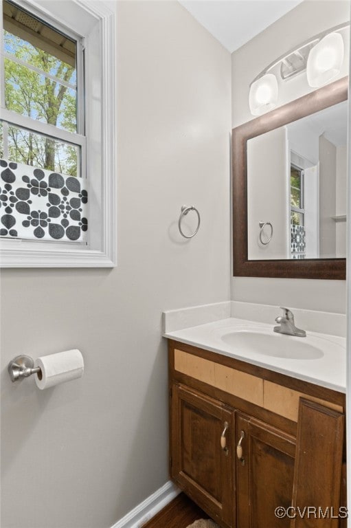bathroom with vanity and baseboards