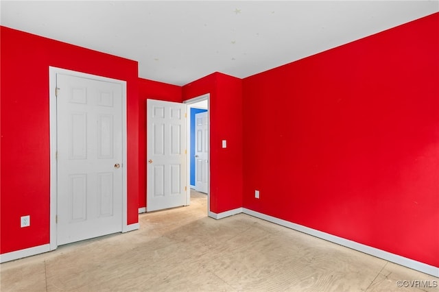 unfurnished bedroom featuring baseboards