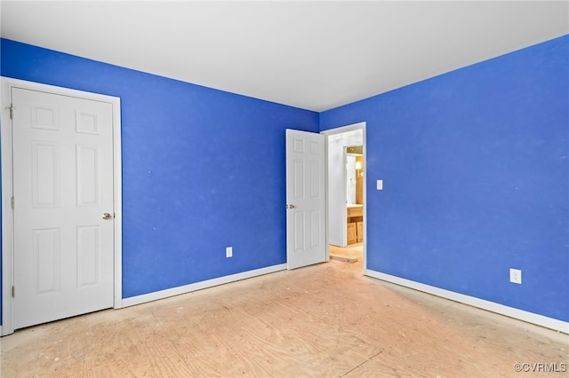 unfurnished bedroom with baseboards
