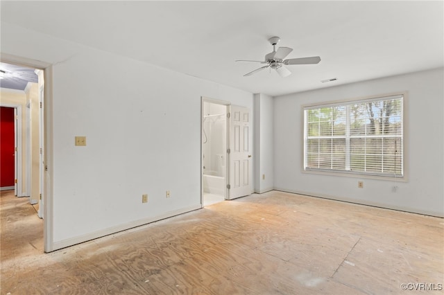 unfurnished room featuring visible vents and a ceiling fan