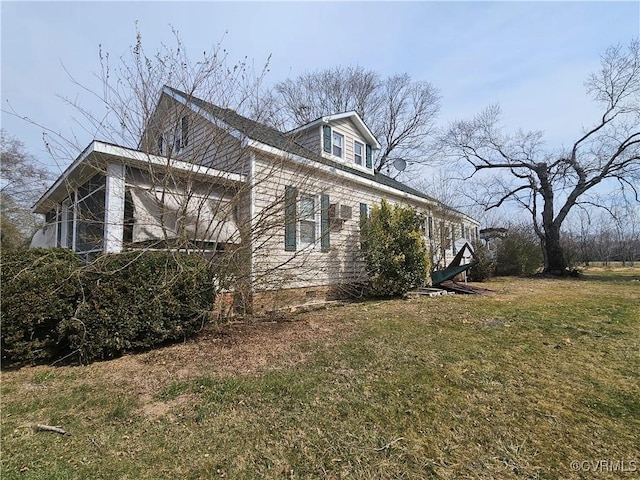view of home's exterior with crawl space and a lawn