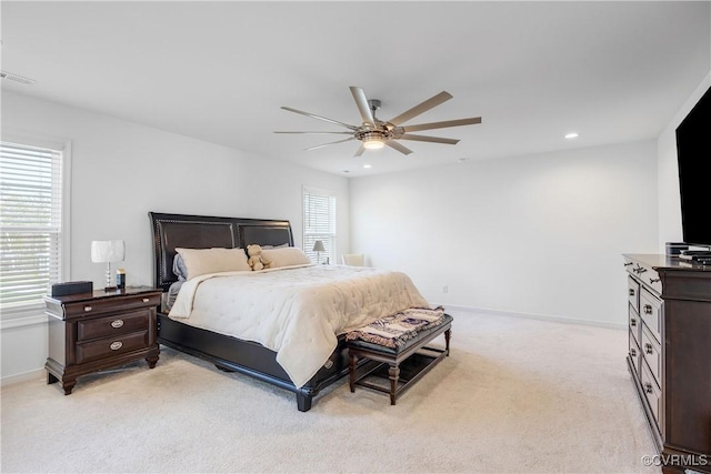 bedroom featuring light colored carpet, baseboards, visible vents, and recessed lighting