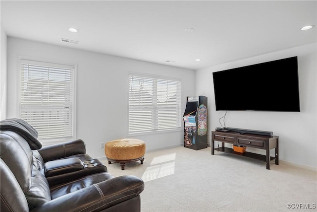 living area with visible vents, baseboards, recessed lighting, and carpet floors